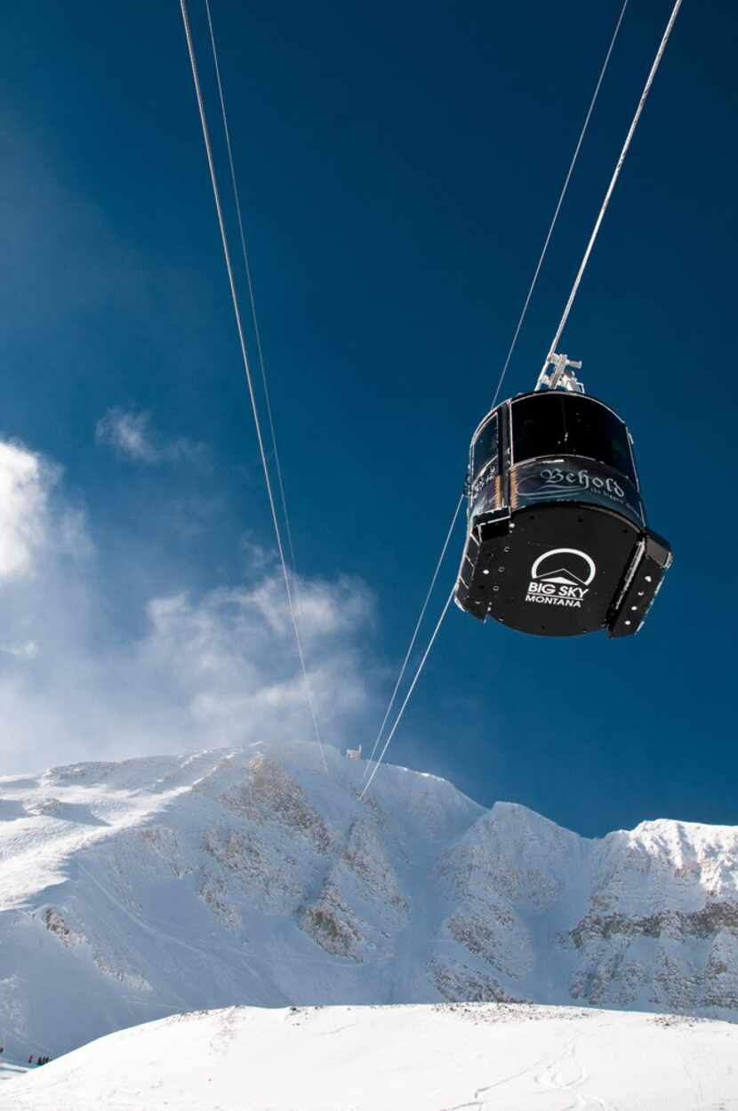 A tram car heads toward the summit of Lone Peak at Montana's Big Sky Resort.  This year, the...