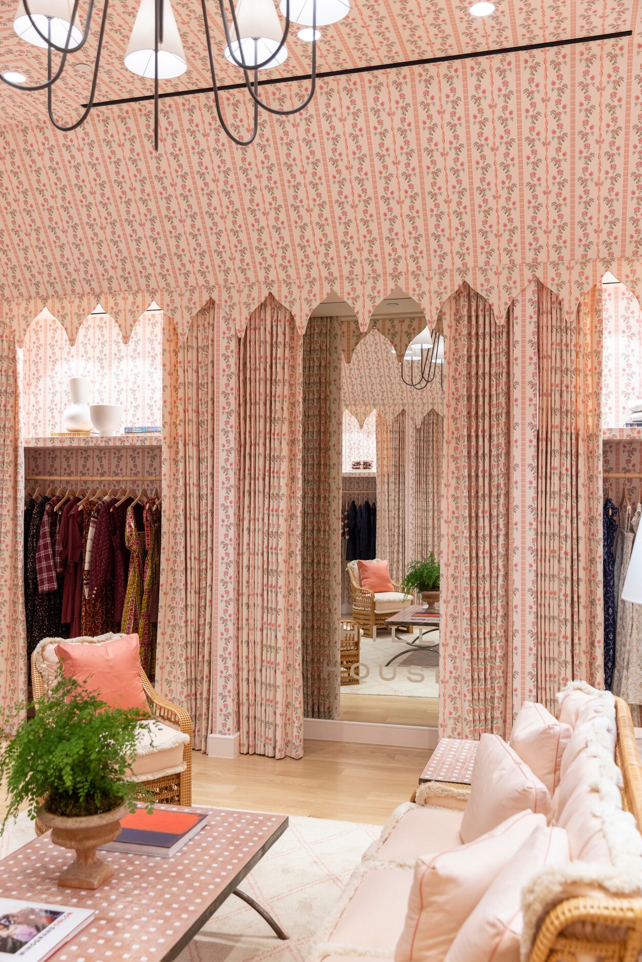 A floral pattern in pink envelopes the store.