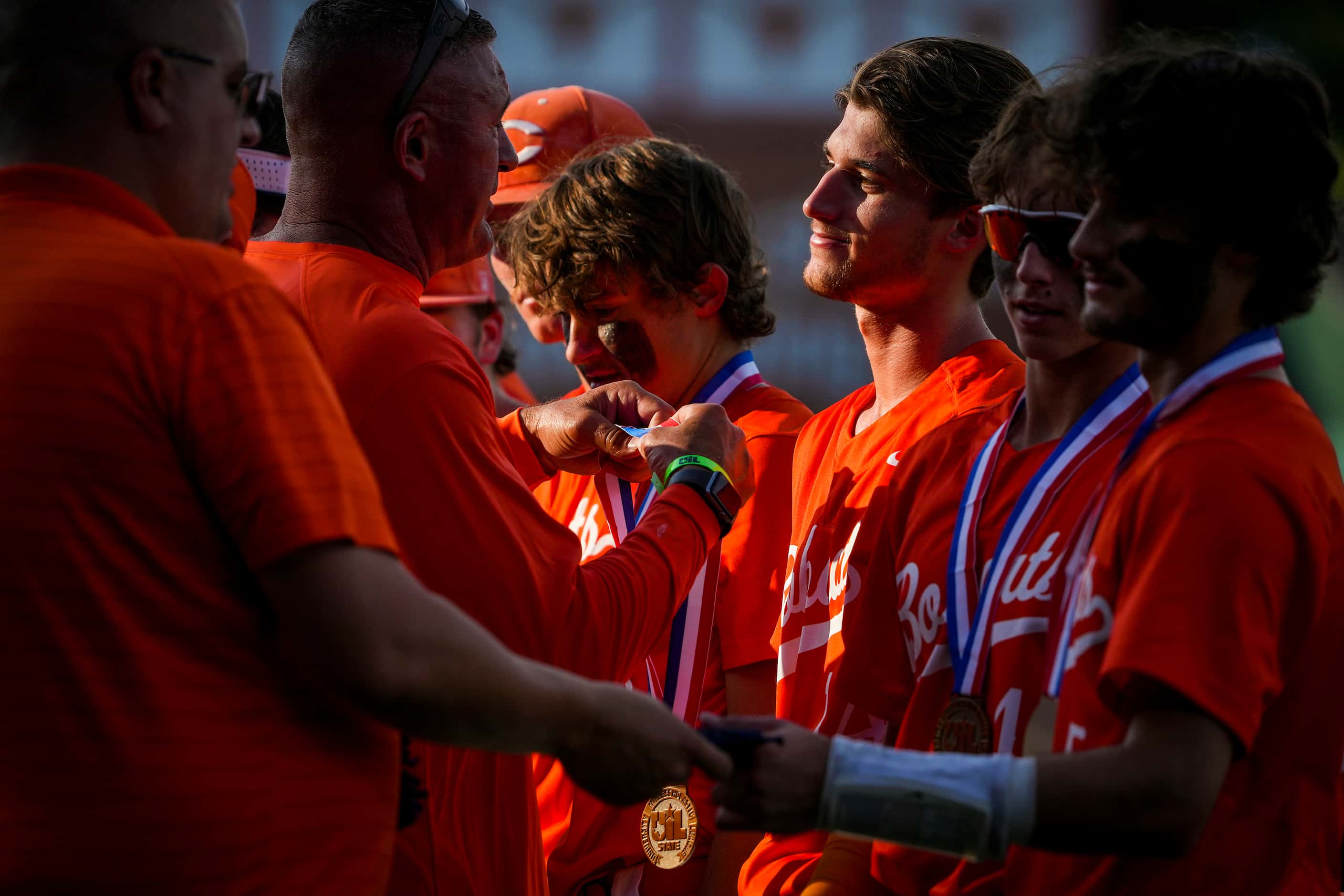 Celina pitcher Cole Marthiljohni receives his state semifinalist medal after a loss to...