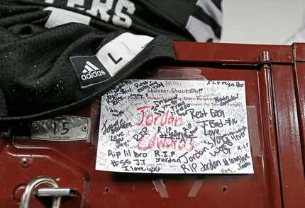 A name card for Jordan Edwards signed by teammates is attached to his locker at Mesquite...