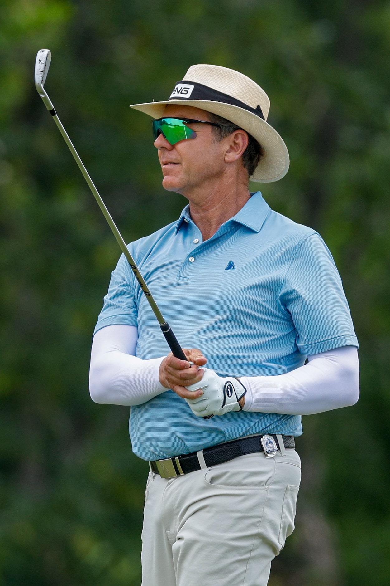 Preston Trail golf pro Cameron Doan watches his shot on the 18th hole during the first round...