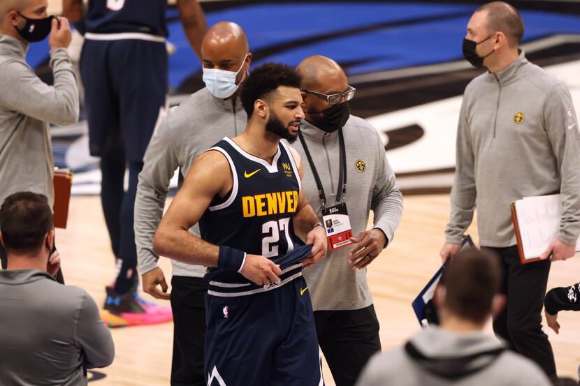 Denver Nuggets guard Jamal Murray (27) is escorted off the court after getting ejected in a...