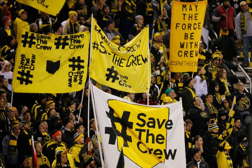 FILE - In this Oct. 31, 2017, file photo, Columbus Crew fans show their support for the team...