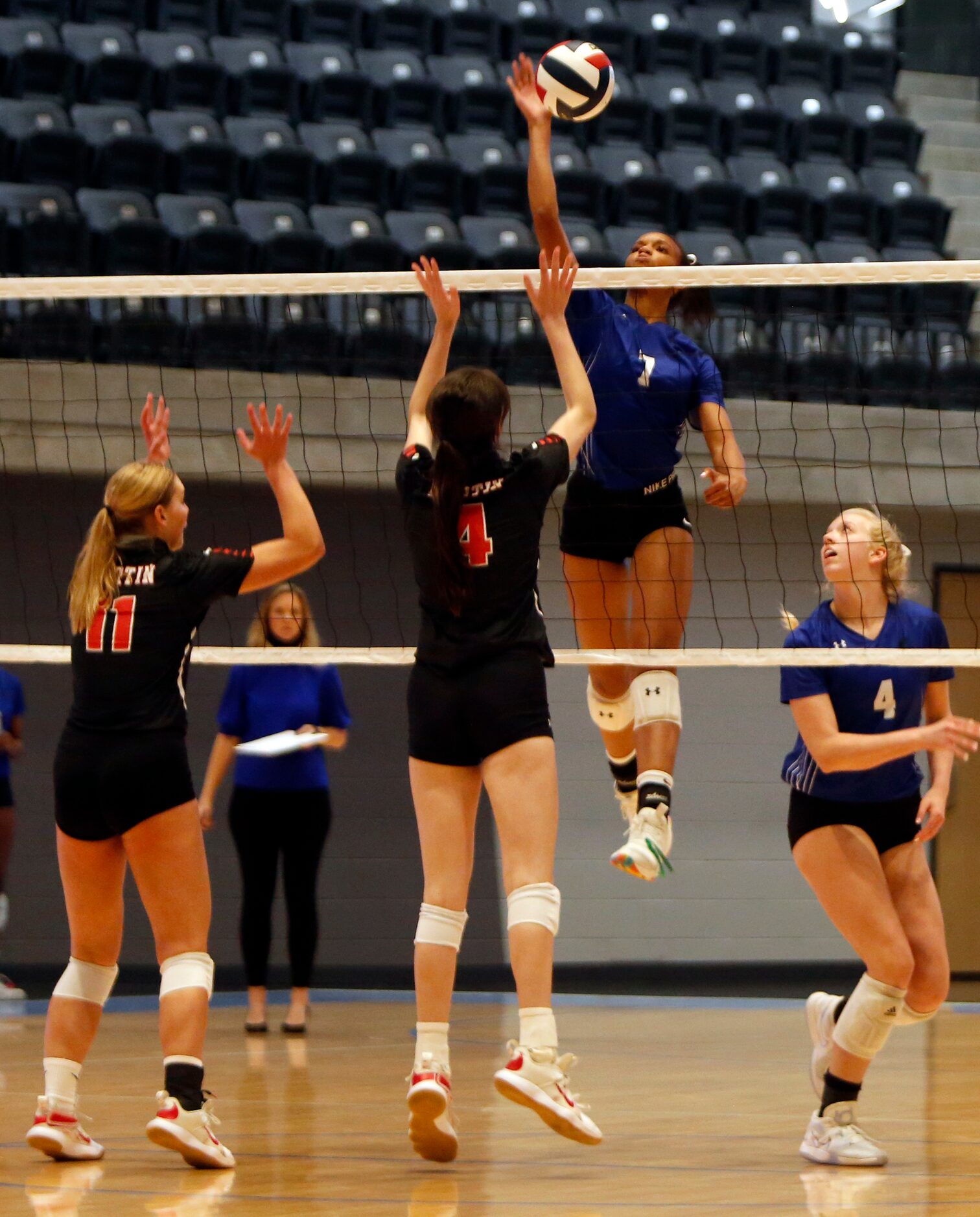 Denton Guyer middle hitter Jordan Williams (7) skies to deliver a winning shot over the...