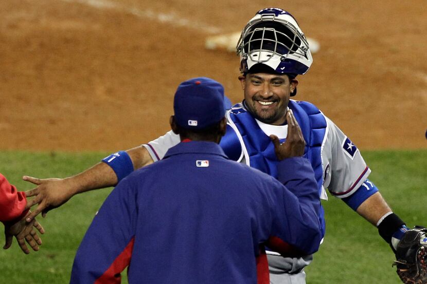 Texas Rangers C Bengie Molina is all smiles as he is greeted by manager Ron Washington after...