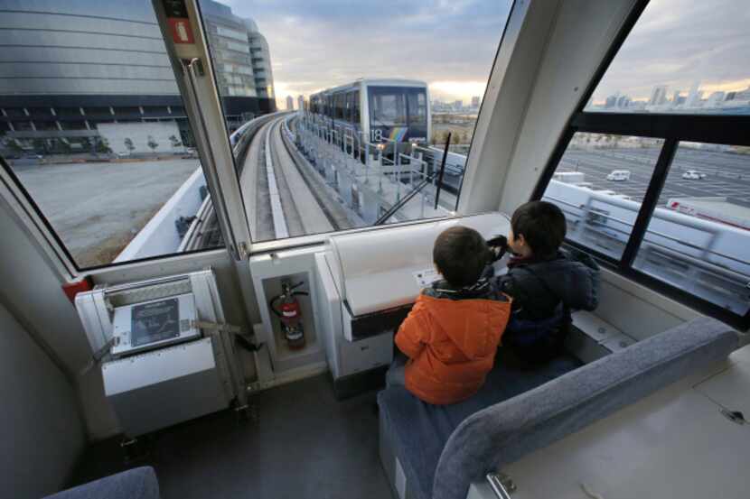 Children ride on Tokyo’s Yurikamome Line, which runs without a driver. A spokesman says the...