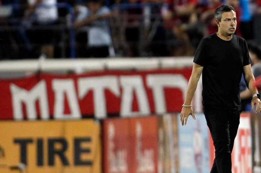 FC Dallas head coach Nico Esteves reacts after a missed scoring opportunity during first...