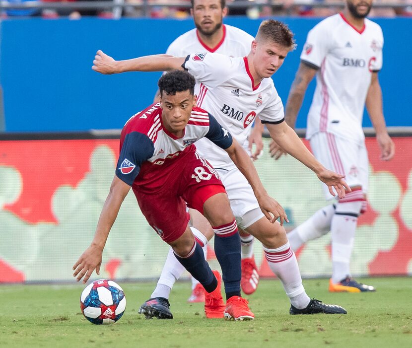 DALLAS, TX - JUNE 22: Brandon Servania dribbled out of traffic during the MLS soccer game...