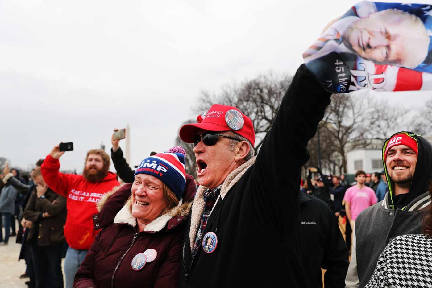 Supporters on the National Mall react to the inauguration of US President Donald Trump....