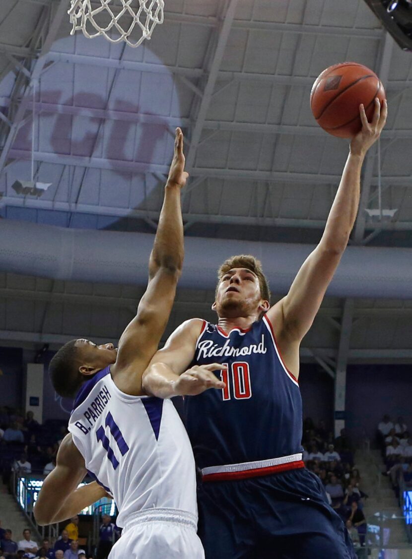 Richmond forward T.J. Cline (10) shoots over TCU guard Brandon Parrish (11) in the first...