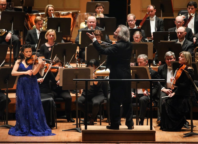 Conducted by Carlos Kalmar, violin soloist Karen Gomyo, left, performs with the Dallas...