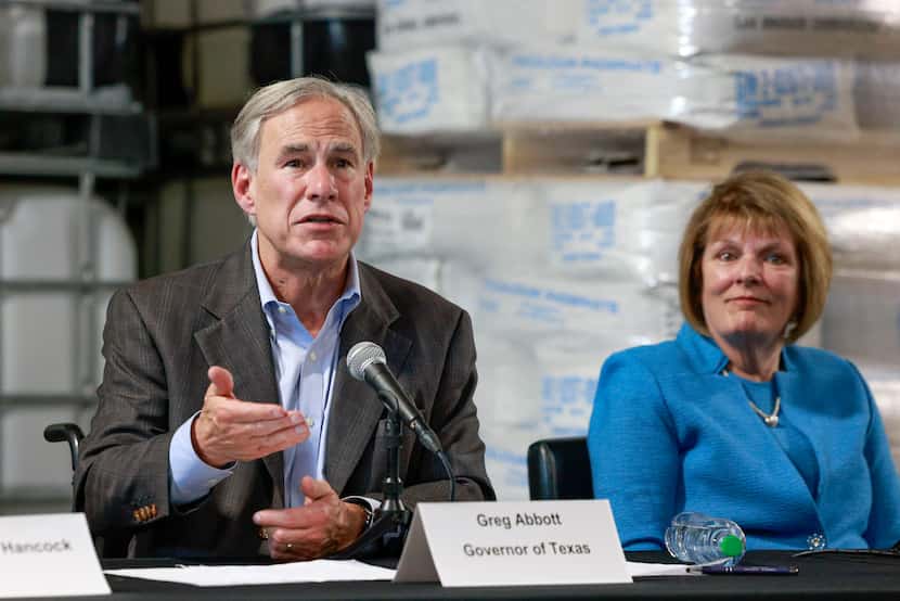 Gov. Greg Abbott speaks to the media alongside State Rep. Stephanie Klick after meeting with...