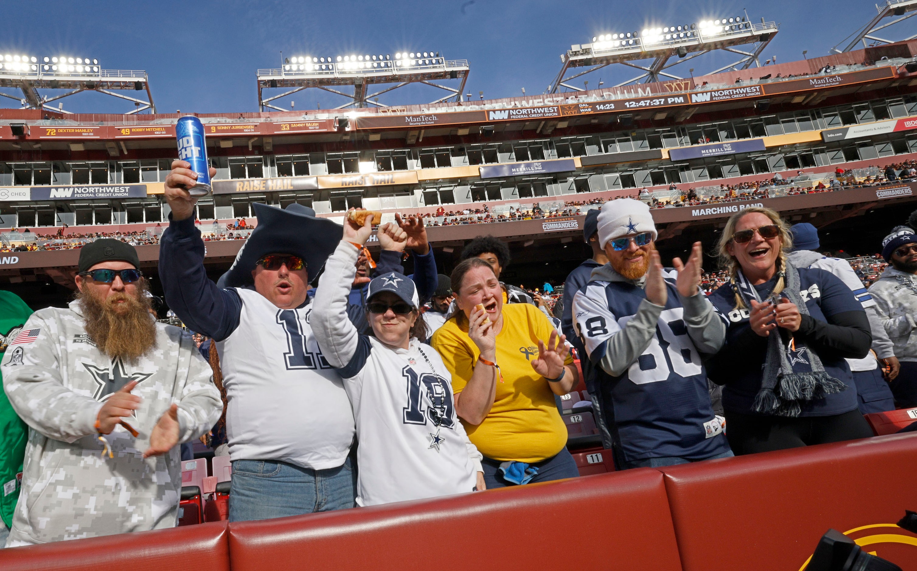 Dallas Cowboys fans cheer before an NFL football game against the Washington Commanders at...