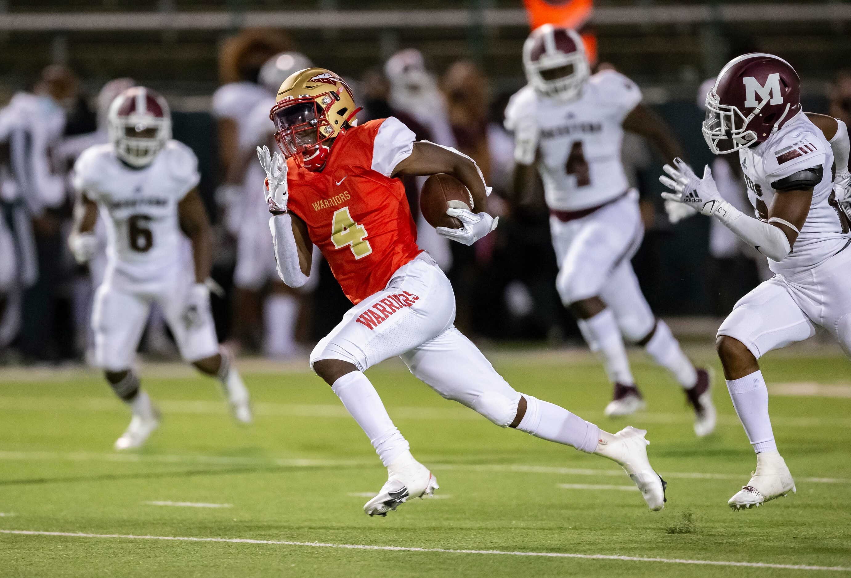 South Grand Prairie senior wide receiver Josh Nicholson (4) breaks past the Mesquite defense...