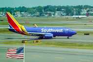 Southwest Airlines and Delta Airlines aircraft taxi at Boston Logan Airport on Tuesday, June...