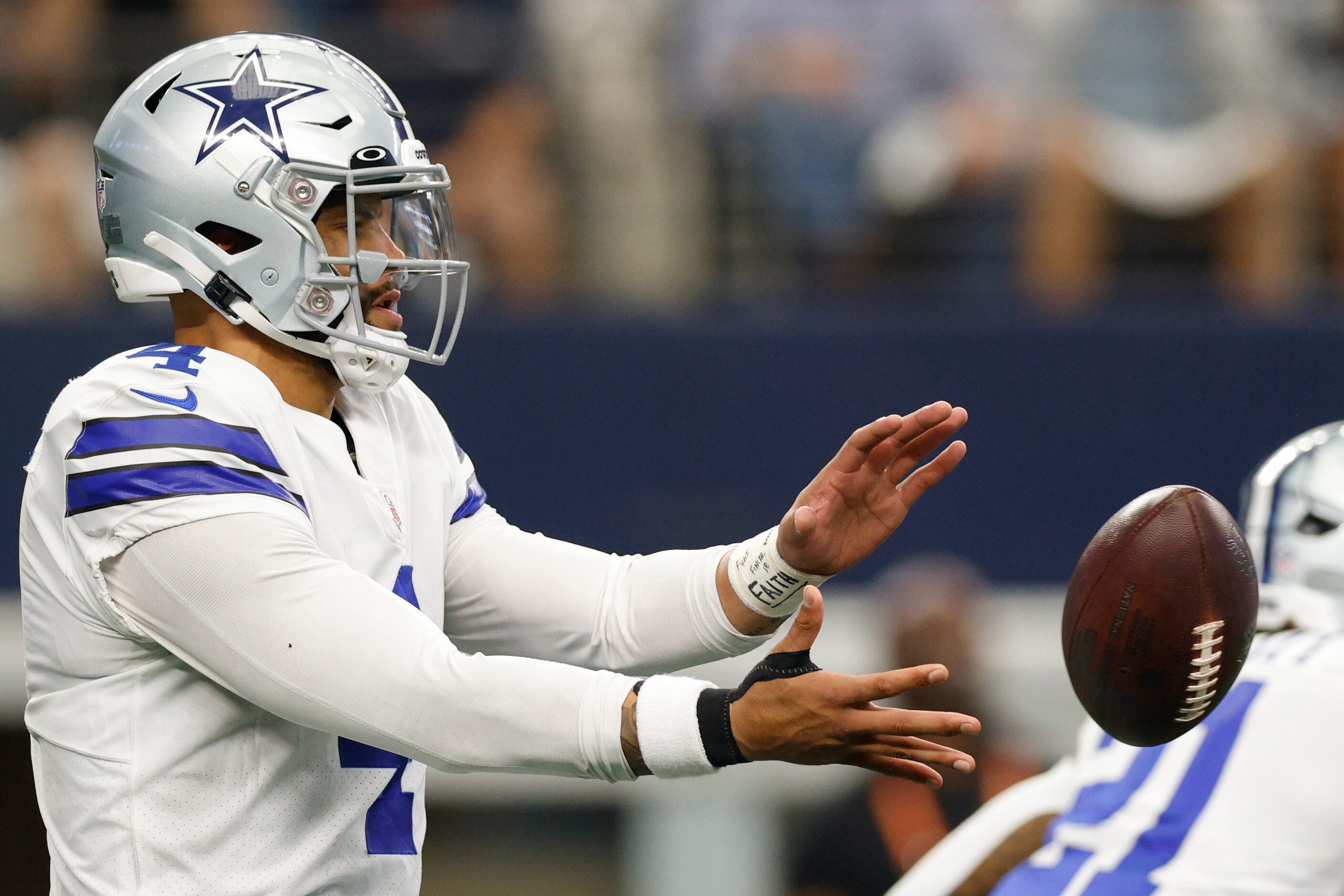 Dallas Cowboys quarterback Dak Prescott (4) takes the snap during the first half of a NFL...