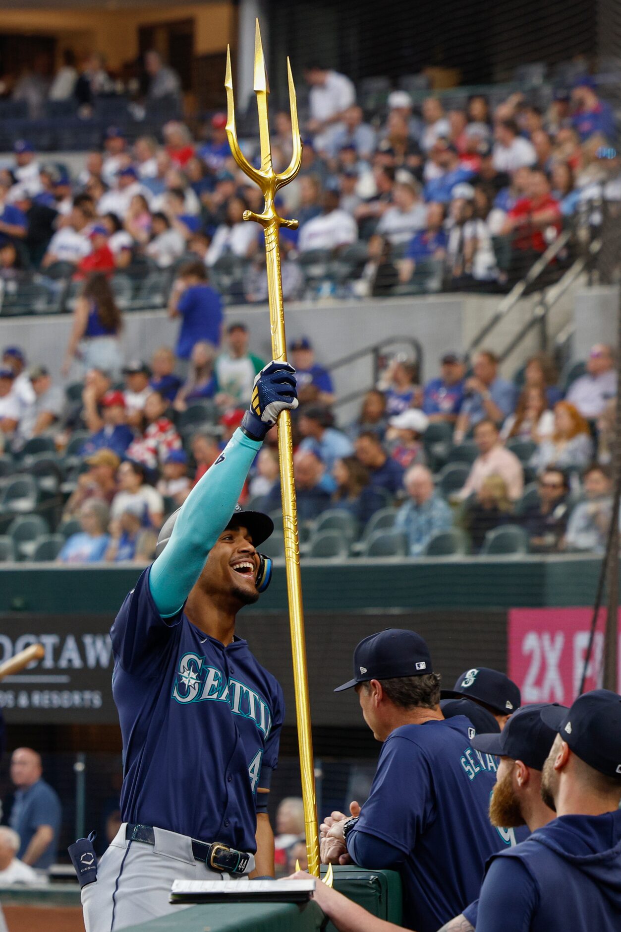 Seattle Mariners center fielder Julio Rodriguez (44) hoists a trident as he celebrates his...