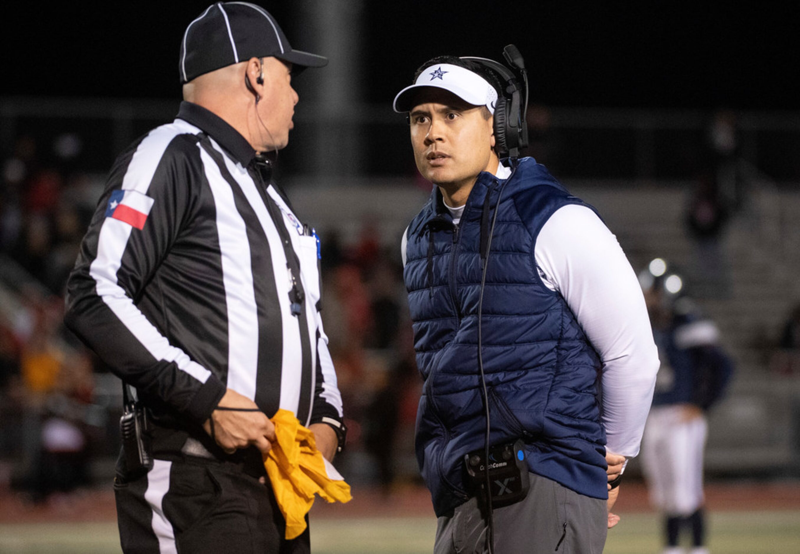 Frisco Lone Star head coach Jeff Rayburn disputes a false start call during the first half...