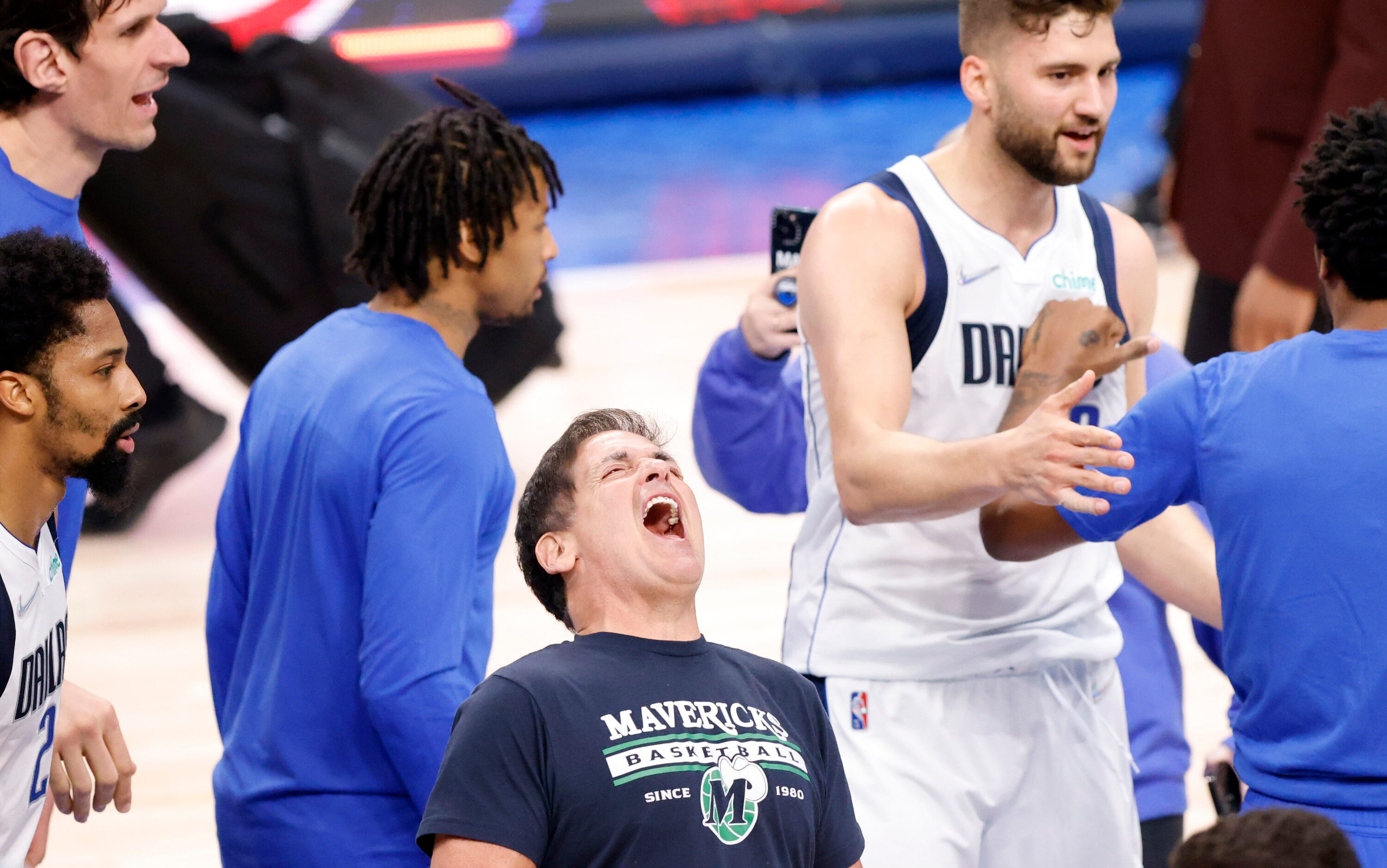 Dallas Mavericks owner Mark Cuban (center) celebrates the team’s win over the Utah Jazz in...