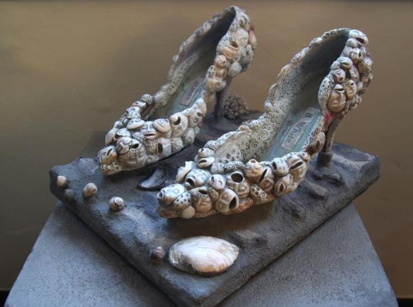 
Williams says an artist made the shoes of carved seashells in response to the Indonesian...