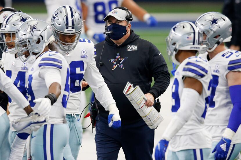 Dallas Cowboys head coach Mike McCarthy makes his way up the sidelines in a game against the...