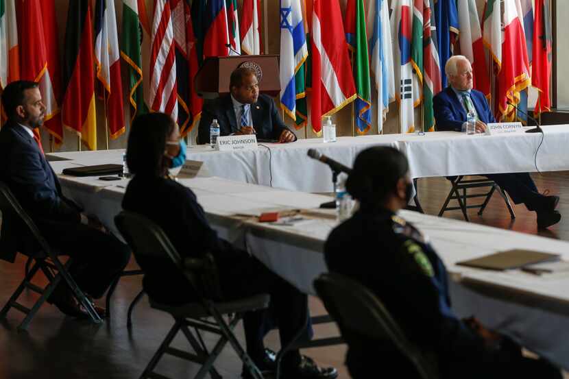 Officials, including U.S. Senator John Cornyn, R-Texas, seated right, and Dallas Mayor Eric...