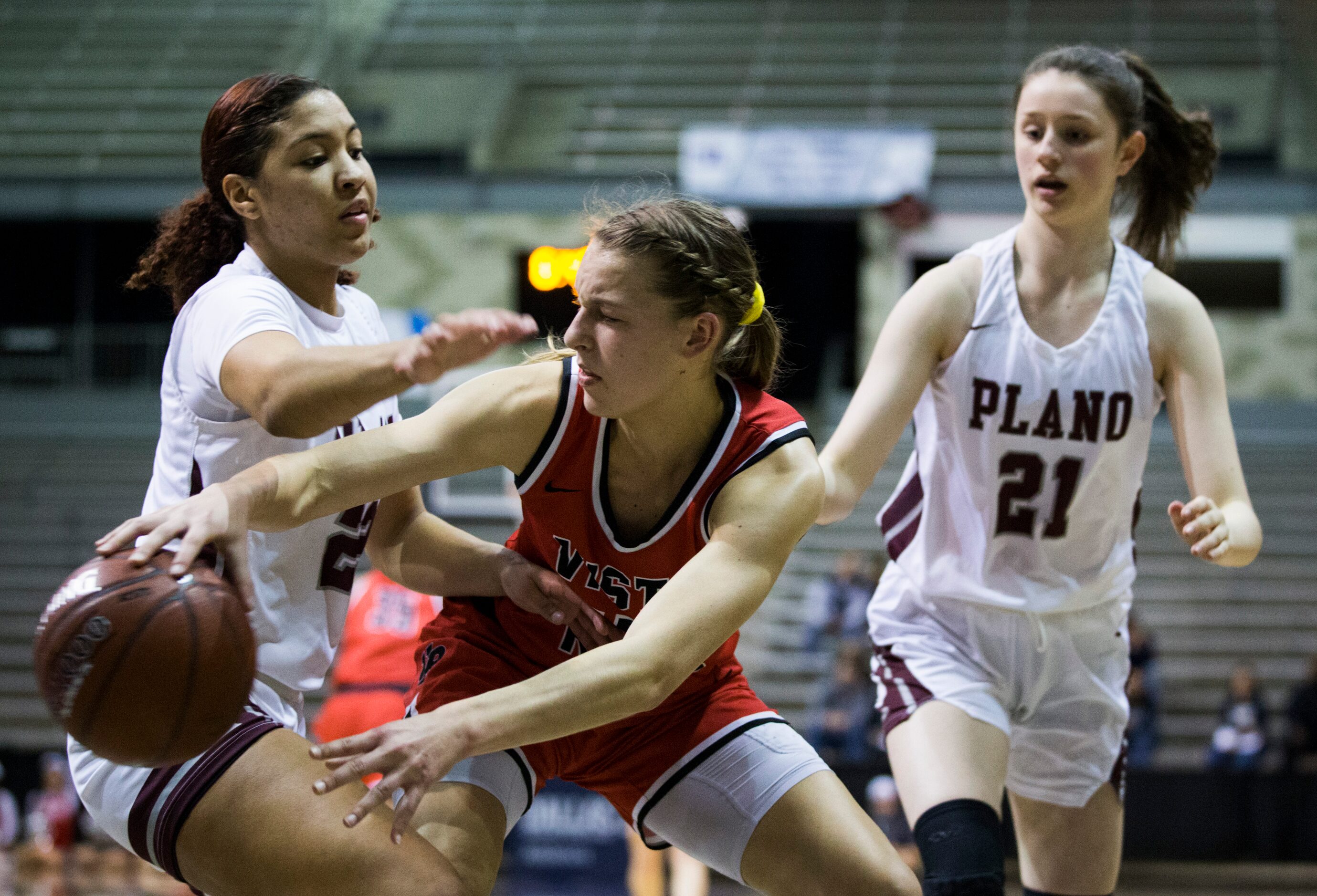 Plano guard Mikayla Eddins (22) and forward Josie Bruder (21) defend against Cedar Park...