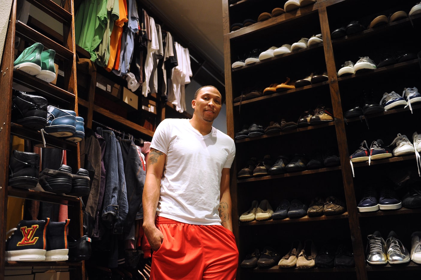 Dallas Mavericks forward Shawn Marion, in his closet at his home in Dallas, Monday, April...