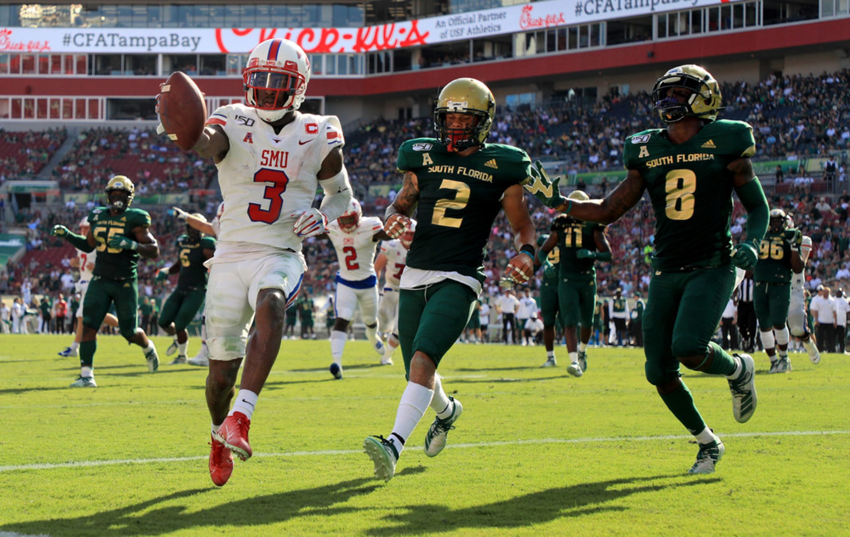 TAMPA, FLORIDA - SEPTEMBER 28: James Proche #3 of the Southern Methodist Mustangs scores a...