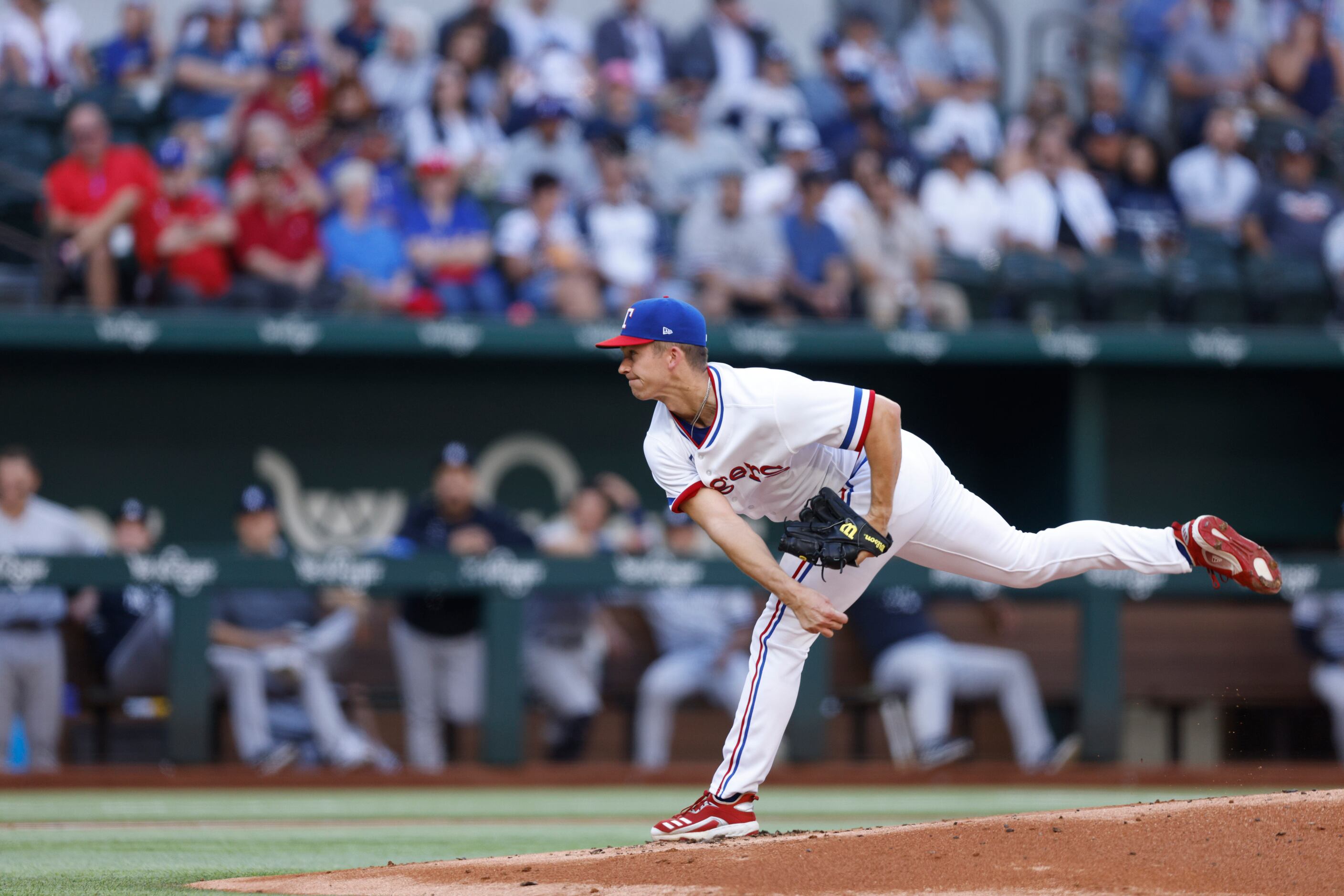 Texas Rangers starting pitcher Glenn Otto (49) delivers a pitch during the first inning of a...