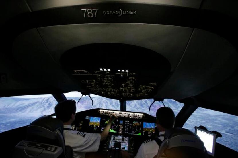 
American Airlines pilots Bill Elder (left) and Jim Dees make a scenic, albeit simulated,...