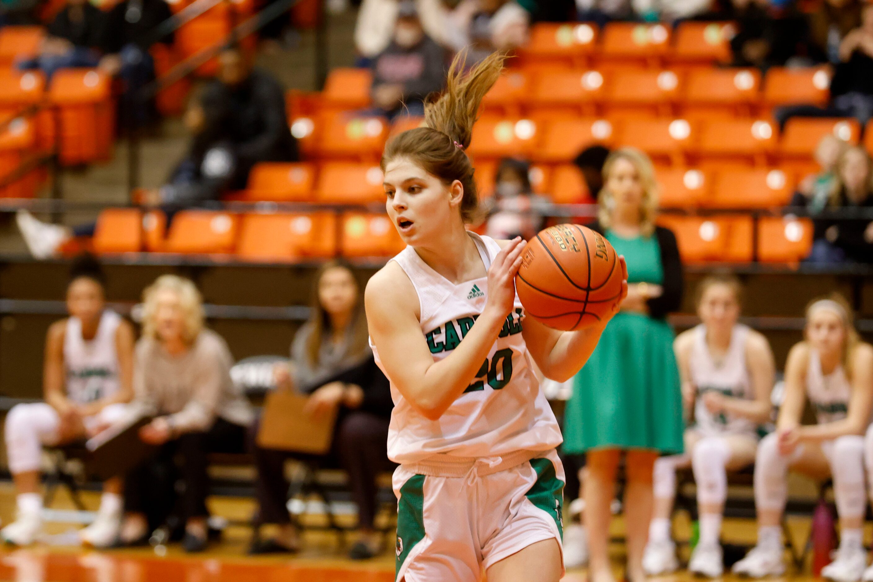 Southlake Carroll’s Camryn Tate (20) grabs a rebound against South Grand Prairie during the...