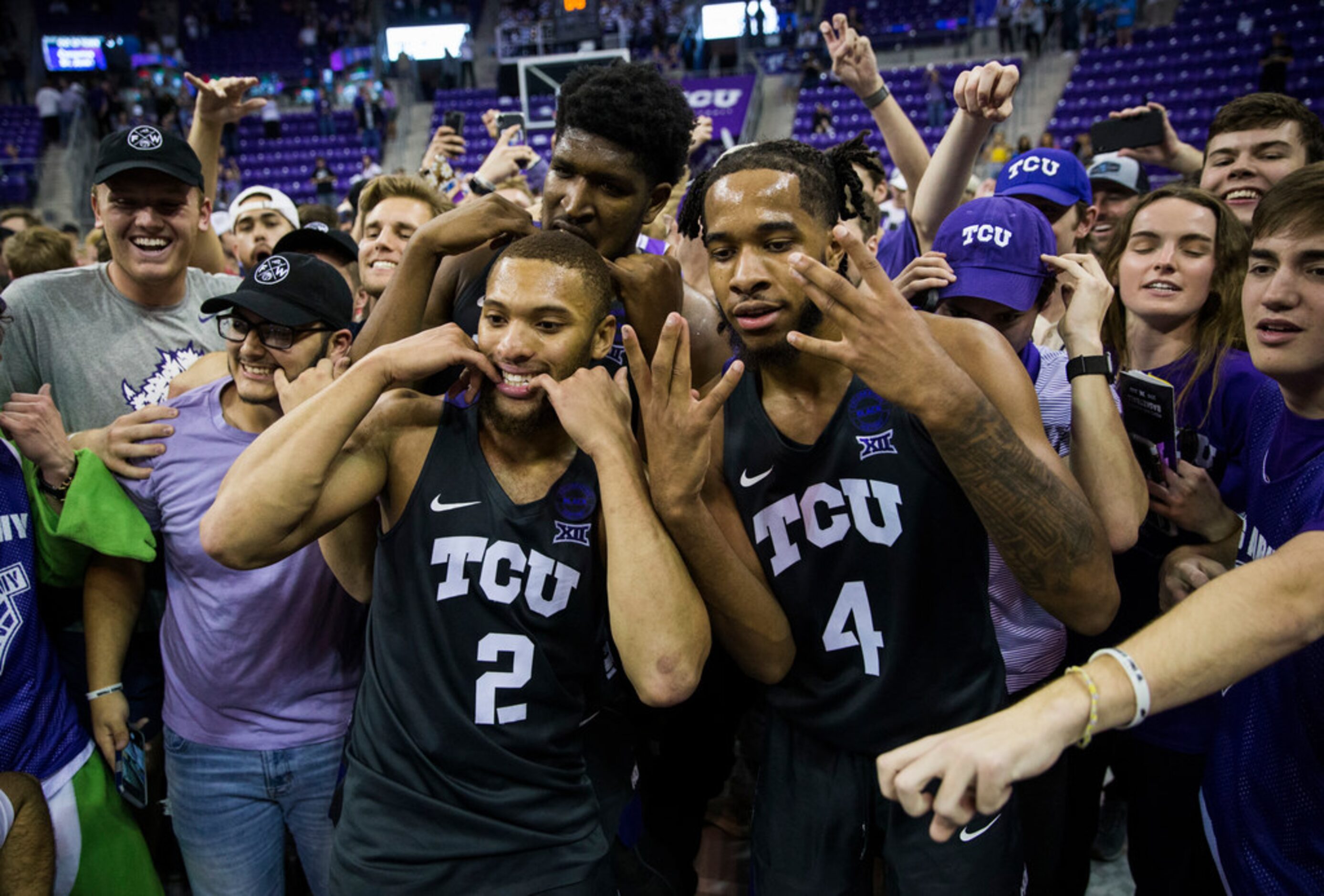 TCU Horned Frogs center Kevin Samuel (21), guard Devonte Bandoo (2), and guard PJ Fuller (4)...