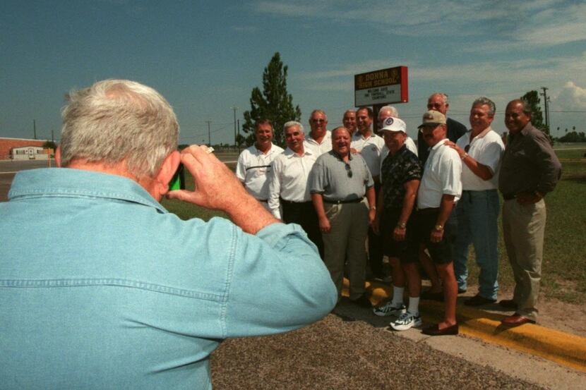 Richard Morley takes a picture of the 1961 Donna High School football team that won the...