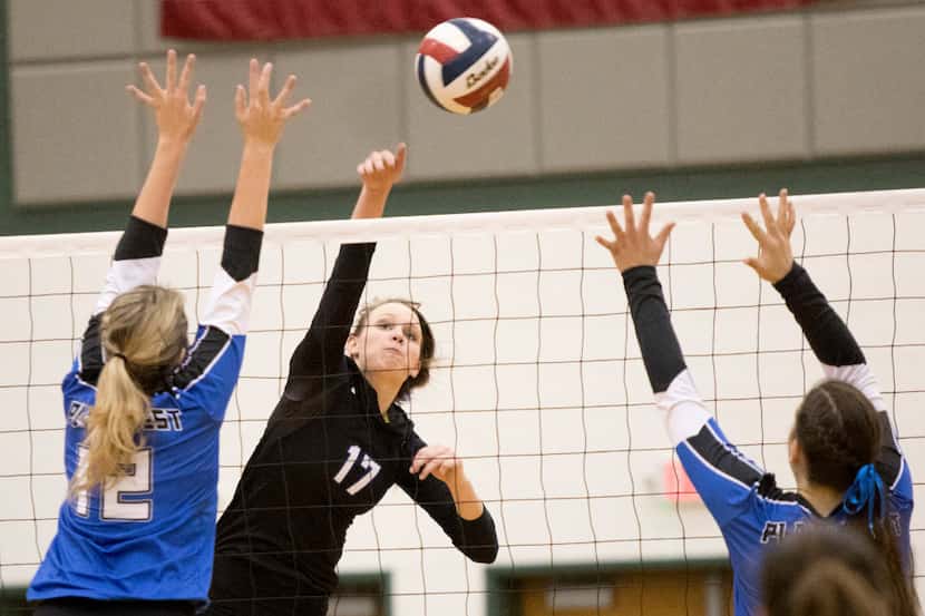 Hebron outside hitter Lauren Merrill (17) spikes during Hebron's 3-0 victory over Plano West...