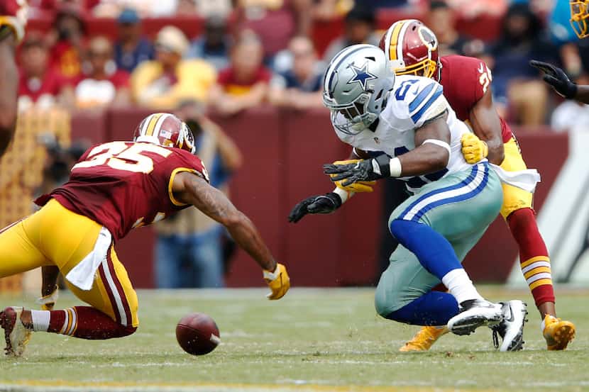 Washington Redskins cornerback Josh Norman (24) forces Dallas Cowboys running back Ezekiel...