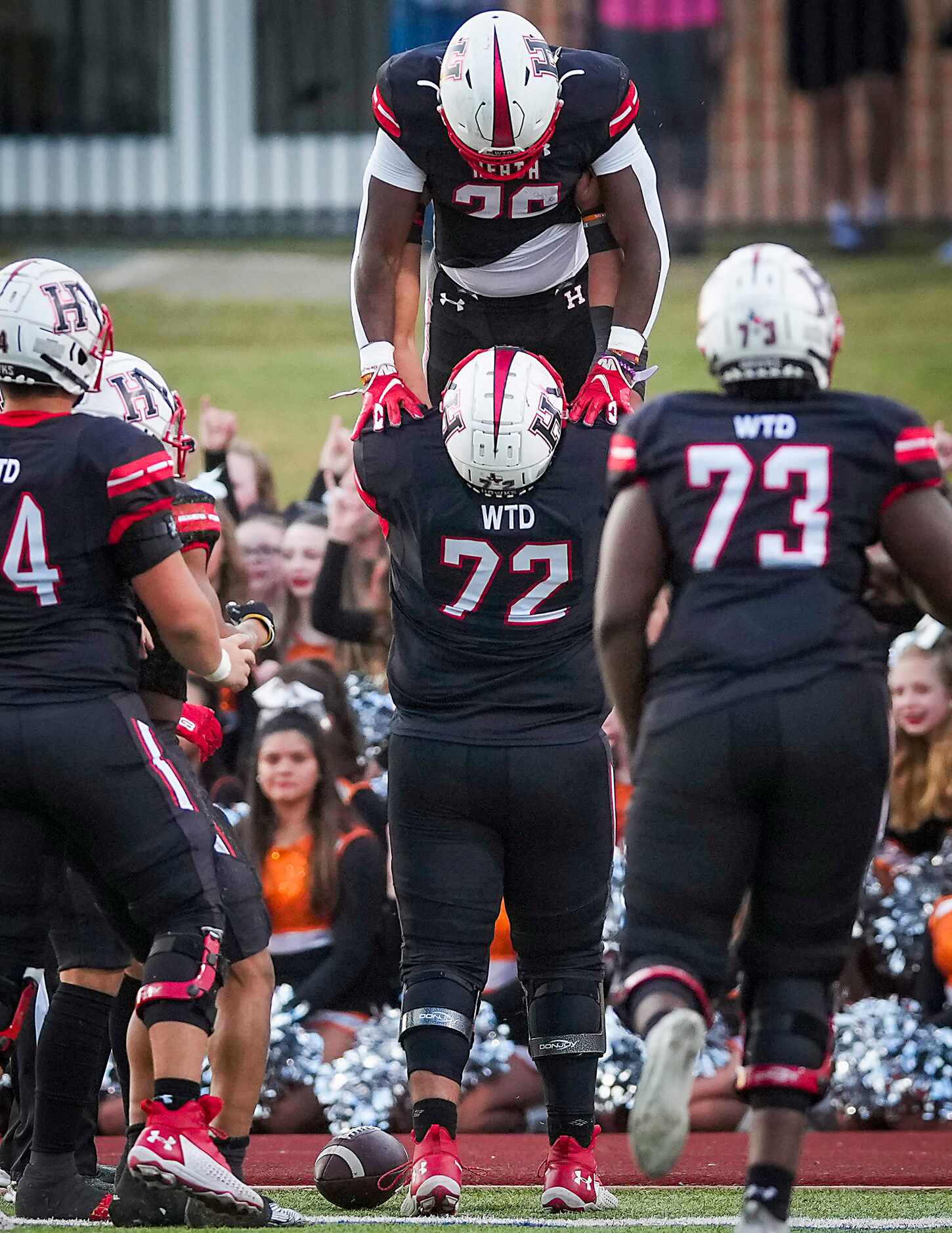 Rockwall-Heath running back  Zach Evans (26) celebrates a touchdown run with offensive...