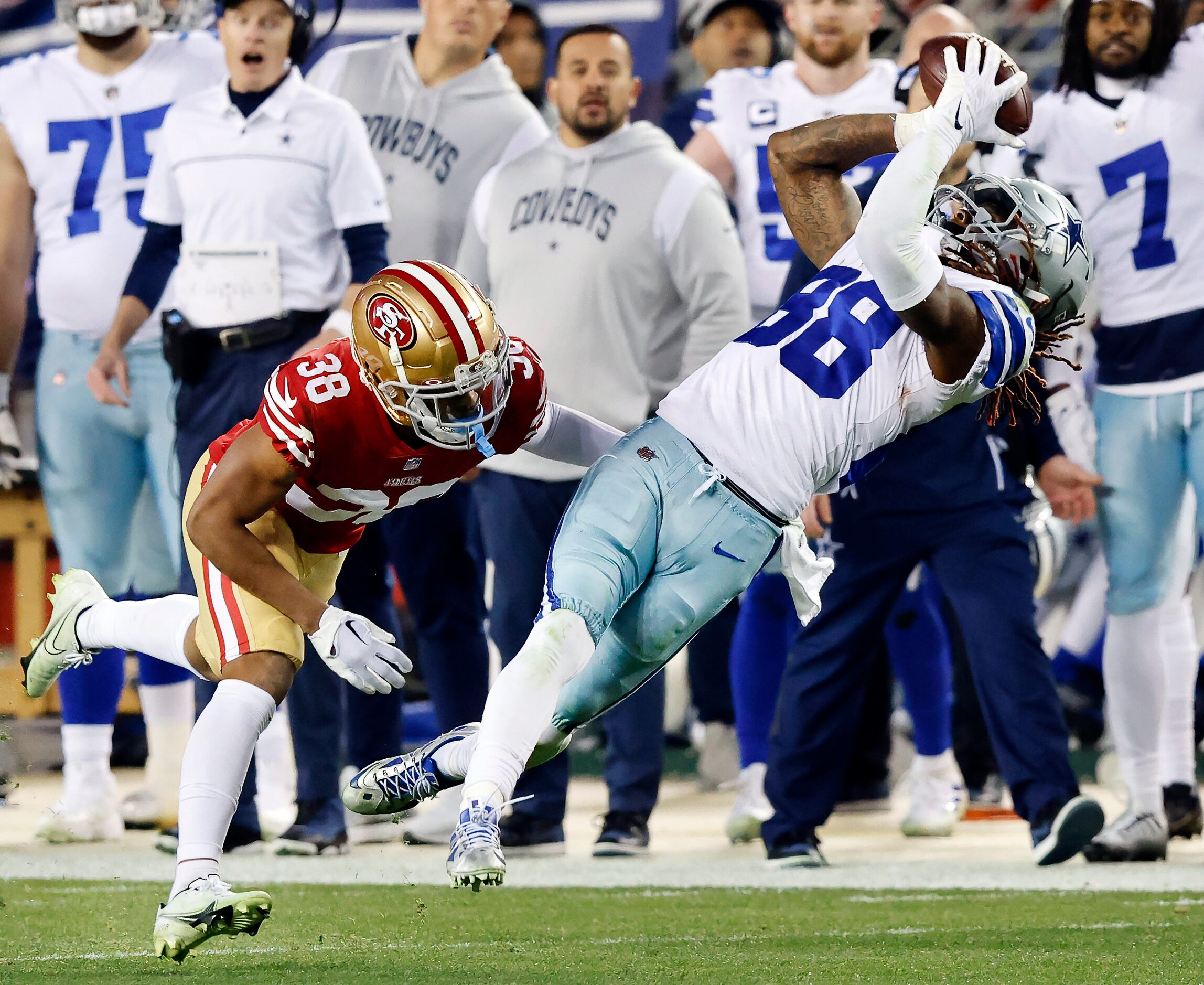 Dallas Cowboys wide receiver CeeDee Lamb (88) hauls in a long pass after San Francisco 49ers...