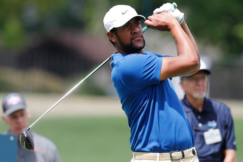 Tony Finau hits off the 18th tee during the first round of the Charles Schwab Challenge golf...