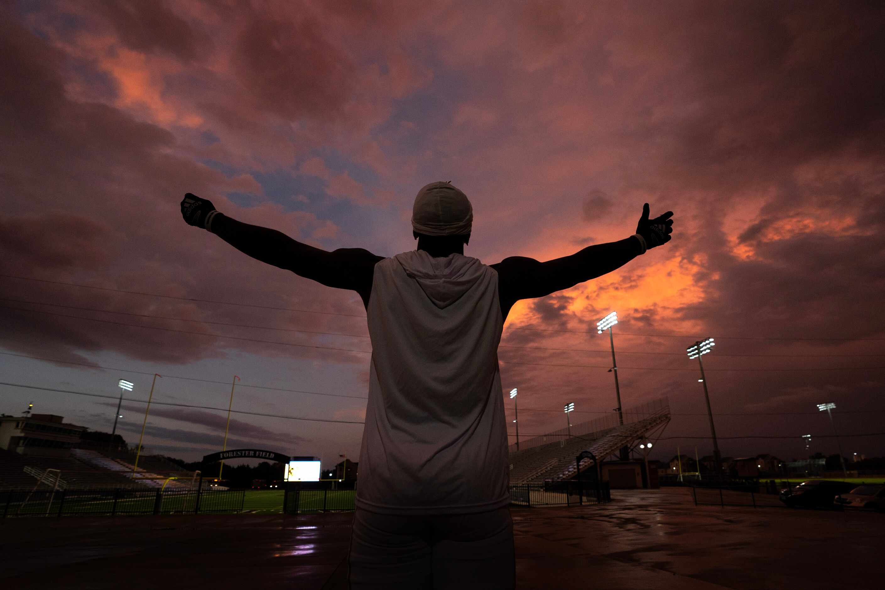 South Oak Cliff defensive lineman Billy Walton gestures towards the sky during a lightning...