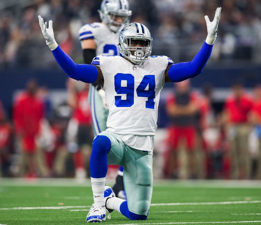 Dallas Cowboys defensive end Randy Gregory (94) tries to pump up the crowd during the third...
