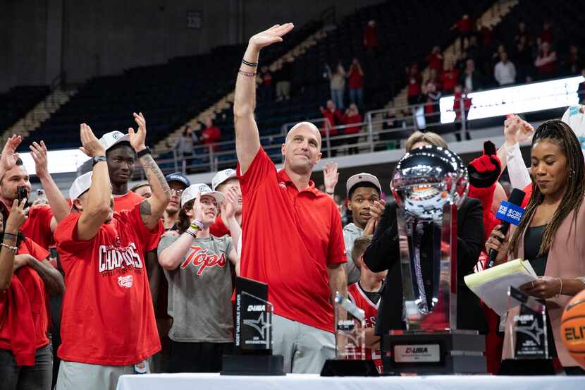 Western Kentucky Hilltoppers Head Basketball Coach Steve Lutz waves to the crowd as the...