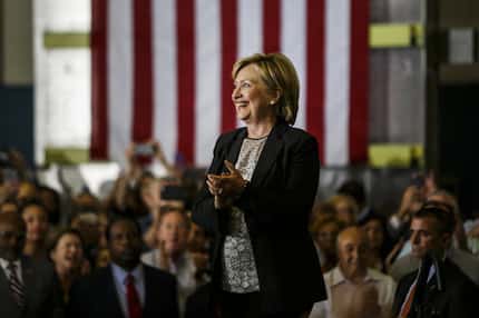 Hillary Clinton, 2016 Democratic presidential nominee, smiles before speaking during a...