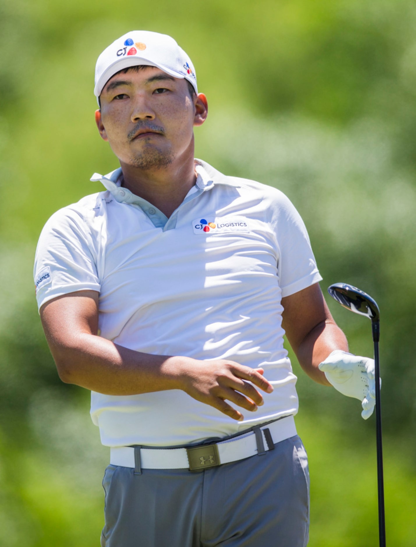 Sung Kang drops his club in response to his drive at hole 4 during round 4 of the AT&T Byron...