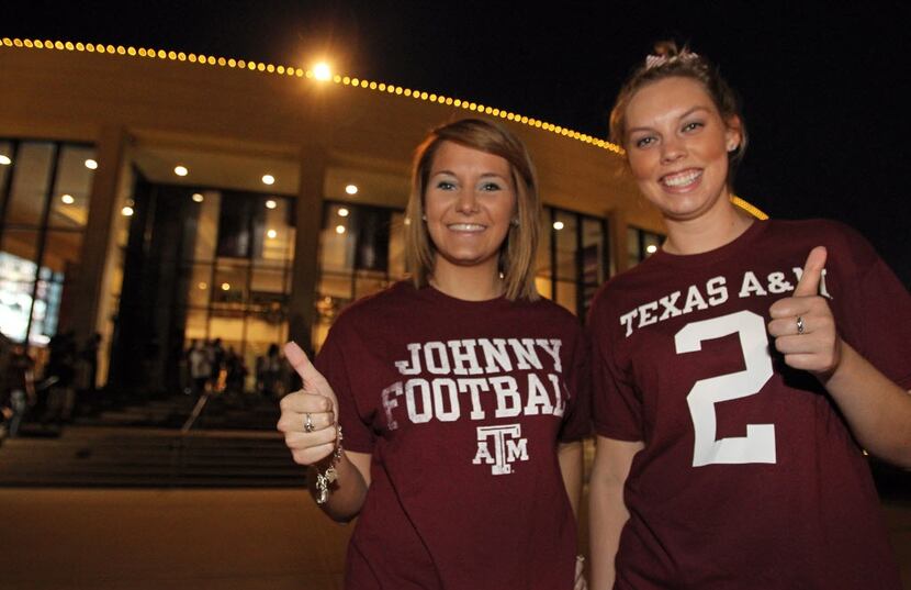 Aggie students Savannah Hughes, left, and Emily Kaiser come dressed for success as they wait...