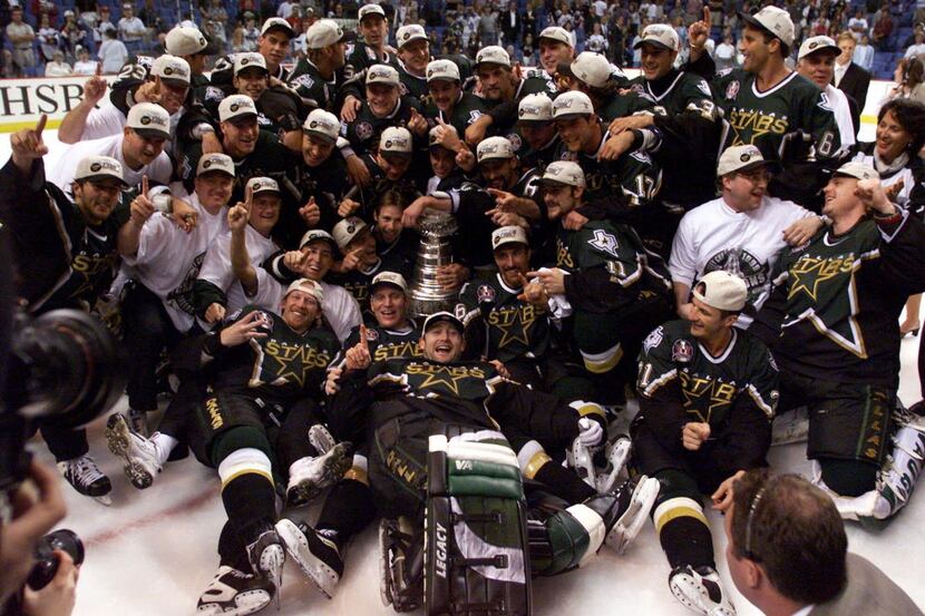 Dallas Stars hockey team pose with the Stanley Cup after the Stars defeated the Buffalo...