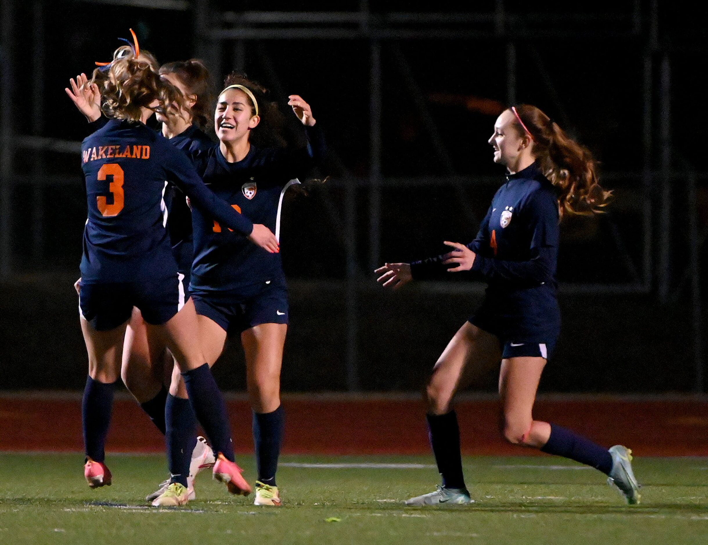 Frisco Wakeland’s Bella James (3), Paria Zabihpour (19) and Lauren Vacek (4) celebrate after...