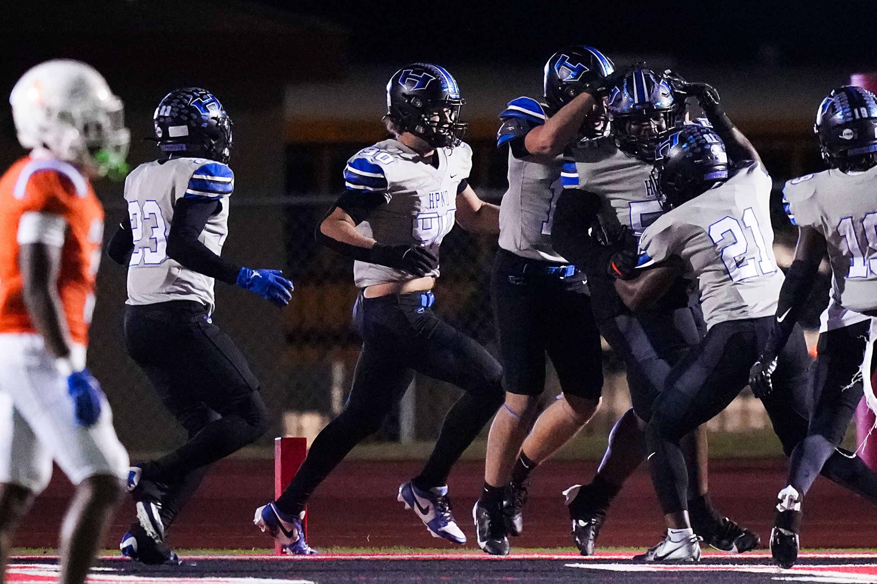 Hebron defensive lineman Daylon Owens (55) celebrates with teammates after returning a...