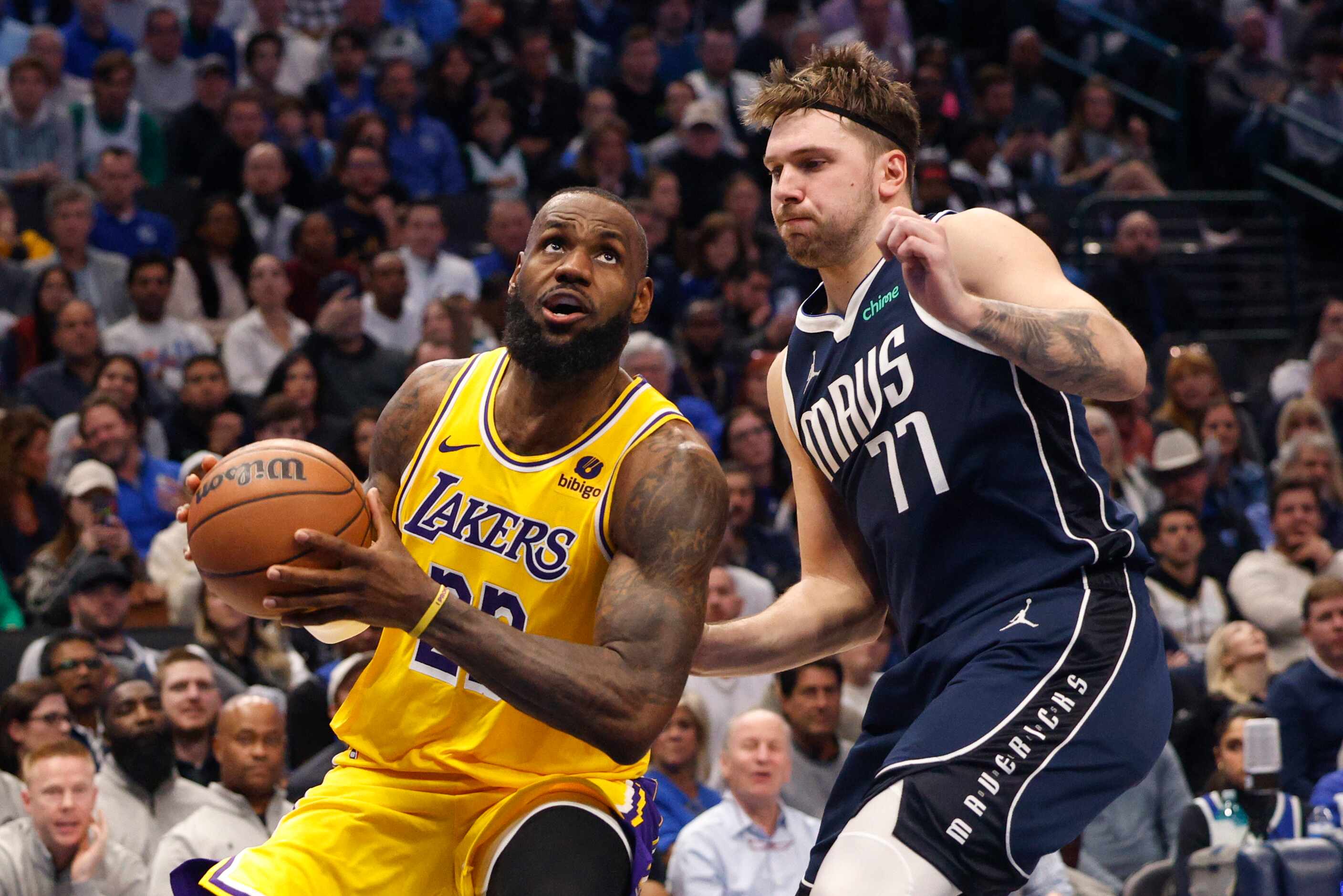Dallas Mavericks guard Luka Doncic (77) defends against Los Angeles Lakers forward LeBron...