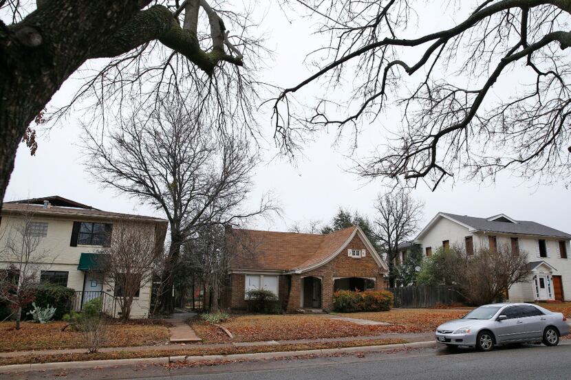 The homes designated to be leveled to make room for a parking garage at Snider Plaza in...
